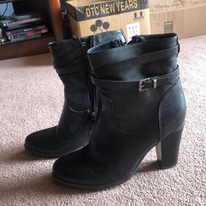 Heeled black leather boots